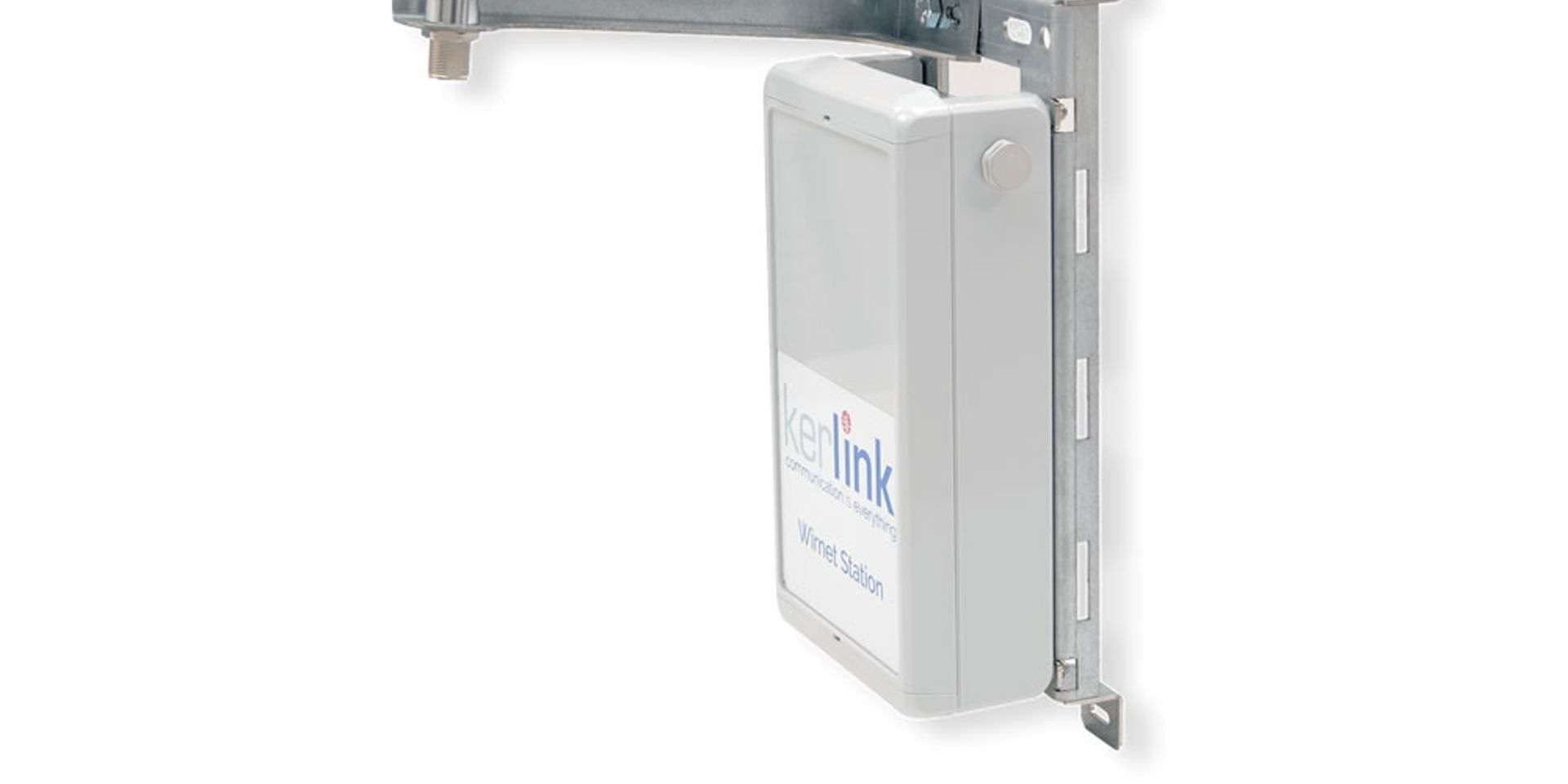 A wall-mounted LoRaWAN gateway with an external antenna on a bracket